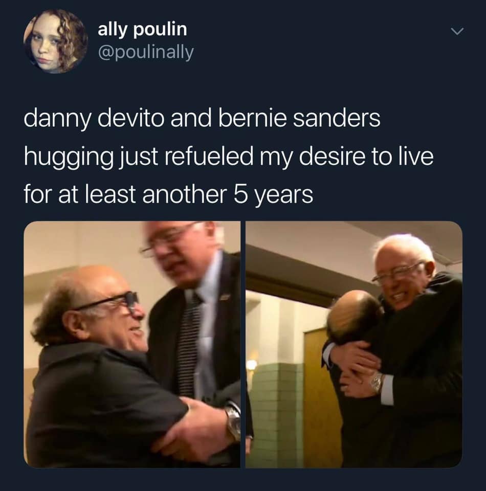 This meme is a humorous comparison between two people, Danny DeVito and Bernie Sanders, who are both known for their age and age-related jokes. The text "danny devito and bernie sanders hugging just refueled my desire to live for at least another 5 years" is a tongue-in-cheek comment on the unexpected and joyful nature of the two men's interaction. The image likely shows a photo of the two men embracing or hugging each other.